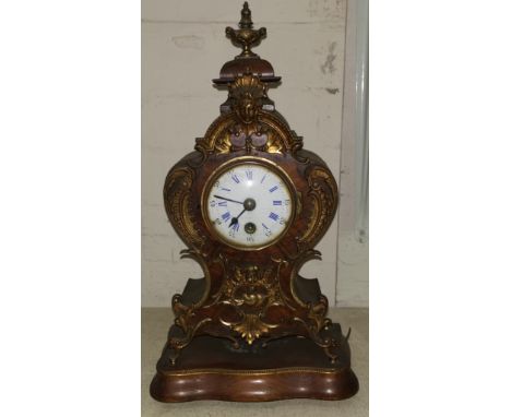 A 19th century mantel clock in walnut ormolu mounted rococo style case, 8 day French movement, white enamel dial, signed indi