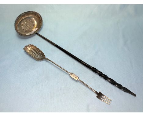 A Georgian punch ladle with inset coin and whalebone handle; a shell bowl sifter spoon with fork terminal 