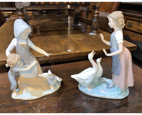 A Lladro group:  girl, boy and goose; a similar Nao group 