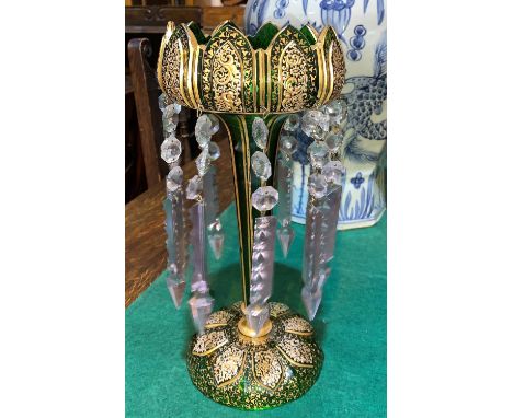 A 19th century green glass lustre overlaid in gilt and white enamel, with tulip top and faceted drops, height 13" 