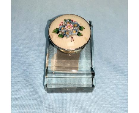 A cut glass inkwell with silver gilded mount, the hinged top decorated with flowers in colour relief enamel, length 7 cm, Bir