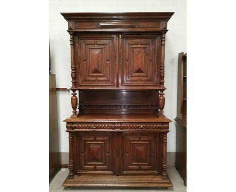 A late 19th century French Provincial oak cabinet, full height, the upper section with twin cupboards and display shelf, the 