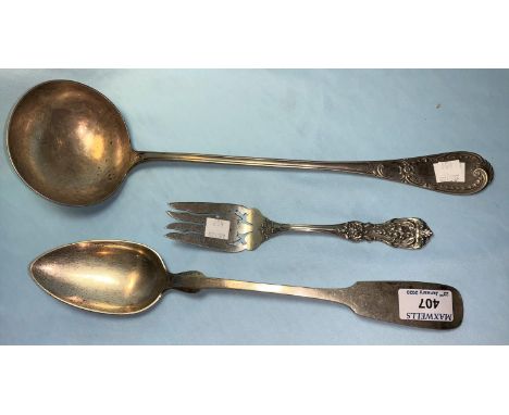 A continental 800 standard silver soup ladle; a white metal basting spoon; an American serving fork, stamped 'sterling', 13 o