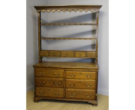 18th Century and later oak dresser, rack and base with quartered gilt mounted columns, on ogee bracket feet, 140cm wide x 56c