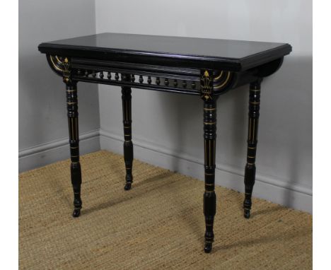 Victorian 'Aesthetic' ebonised and gilt card table, with red baize lining, 92cm wide x 46cm deep x 73cm high Good overall con