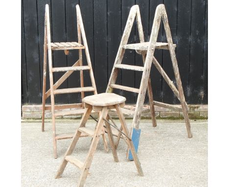 A wooden step ladder, 140cm high, together with two others
