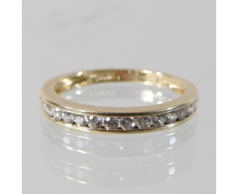 A 14 carat gold eternity ring, boxed