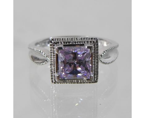 A 14 carat gold square set amethyst ring, boxed