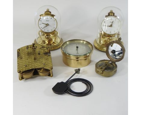 A 1930's walnut mantel clock, 24cm high, with a Garrard movement, together with two anniversary clocks, a compass, and a baro