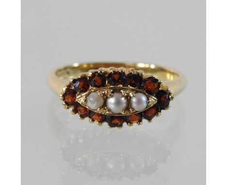 A 9 carat gold garnet and pearl ring, boxed