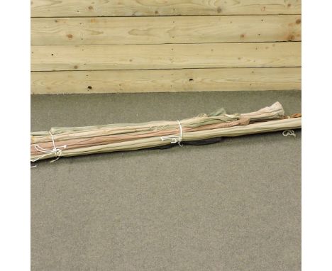 A collection of eleven vintage fishing rods, to include three by Hardy Bros