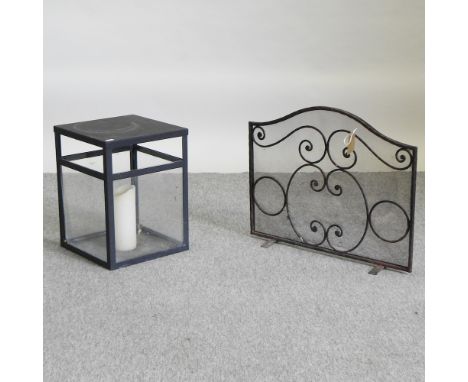 A Jim Lawrence garden lantern, together with a wrought iron fire screen, 60cm
