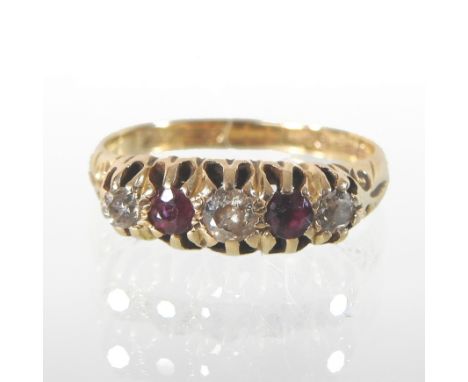 An 18 carat gold ruby and diamond five stone ring, with a textured setting, together with a silver bangle and a simulated pea