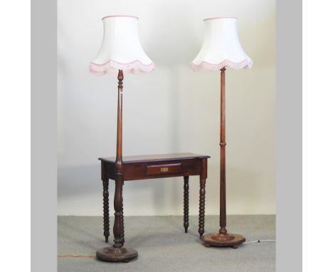 An early 20th century oak standard lamp and shade, 191cm high overall, together with another similar and a reproduction side 