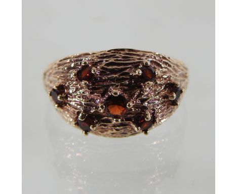 A 9 carat gold vintage ring, set with garnets, boxed