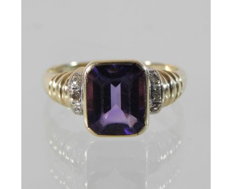 A 14 carat gold amethyst and diamond ring, boxed