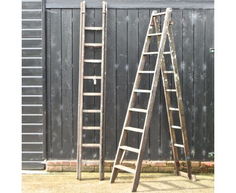 A wooden folding step ladder, together with another larger, 255cm high