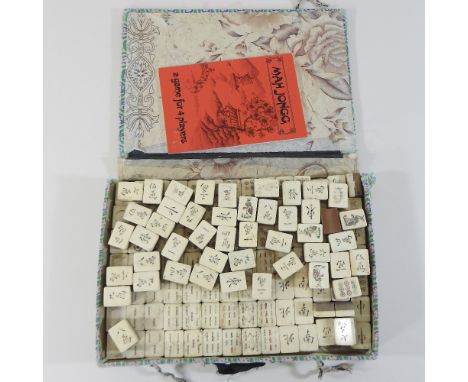 A vintage mahjong set, cased