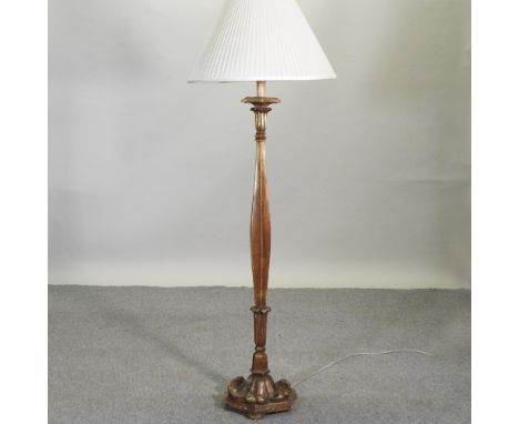 A continental carved and gilt wooden standard lamp and shade, 160cm high overall