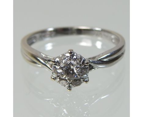 An 18 carat gold diamond ring, 0.25 carat overall, boxed