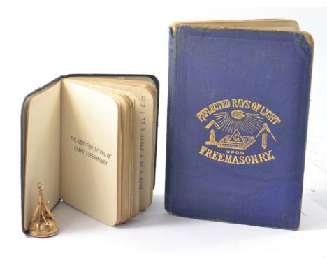 VERY INTERESTING lot comprising of 2 masonic books and a 9ct MASONIC FOB 5.4g gross, the 2 small books, 1 reflected rays of l