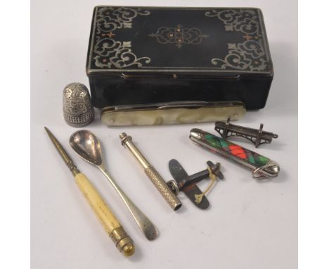 A Vintage small black inlaid trinket box contains 2 pen knives &amp; asstd white metal items 