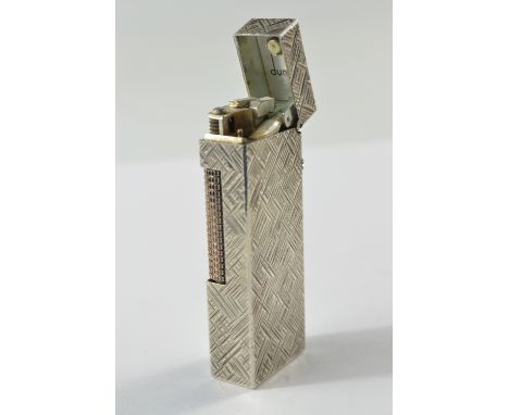 White chased metal Dunhill lighter c1970's, length 6.4cm, depth 1.2cm and width is 2.3cmIn good condition, no scratches or de
