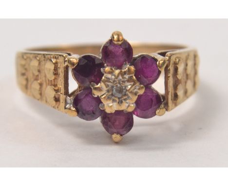 9ct Amethyst and diamond floral set ring, with hearts on the shoulders. Size MGross weight approx 3.5g