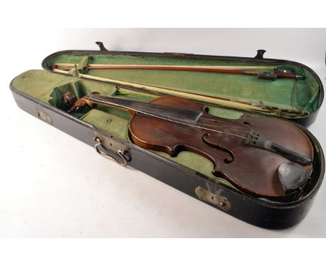 Vintage violin in wooden case with bows
