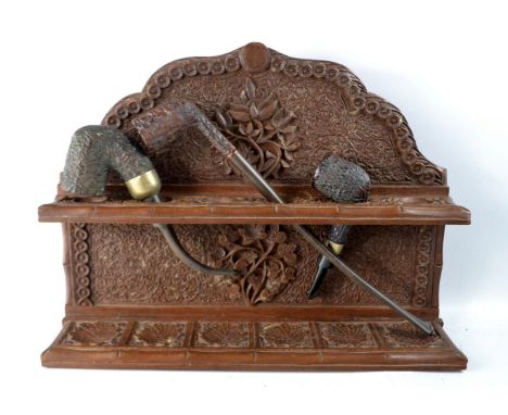 An old wall mounted BAVARIAN BLACK FORREST style pipe rack to include 3 very vintage pipes, one pipe very long shaft at 26cm 