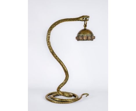 AN AUSTRIAN ART NOUVEAU BRASS SNAKE TABLE LAMP, realistically modelled coiled, its raised head hanging a domed shade with a b