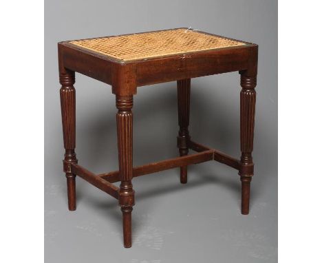 A REGENCY MAHOGANY DRESSING STOOL IN THE MANNER OF GILLOWS, early 19th century, of rounded oblong form with drop-in caned sea