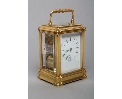 A BRASS CASED CARRIAGE CLOCK, modern, the twin barrel movement with platform escapement striking on a gong, repeat button, pl