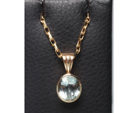 AN AQUAMARINE PENDANT, the facet cut oval stone collet set to a fixed reeded 9ct gold gold bale, with a fine chain necklace, 