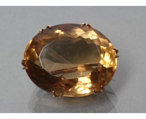 A LATE VICTORIAN CITRINE BROOCH, the oval facet cut stone claw set to a plain frame, stamped 9ct (Est. plus 21% premium inc. 