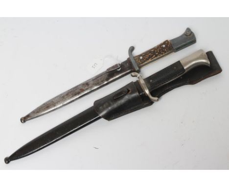 TWO THIRD REICH DRESS BAYONETS, comprising a fireman's bayonet, with 10" blade marked for PUMA, metal scabbard and leather fr