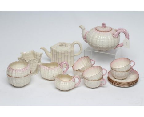 A VICTORIAN FIRST PERIOD BELLEEK PORCELAIN NAUTILUS TEA SERVICE with shaded pink rims, comprising six cups and saucers, teapo