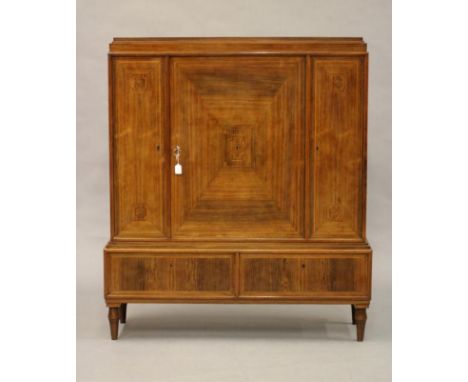 A ROSEWOOD SALON CABINET, first half 20th century, of stepped oblong form, the geometrically veneered fascia with three doors