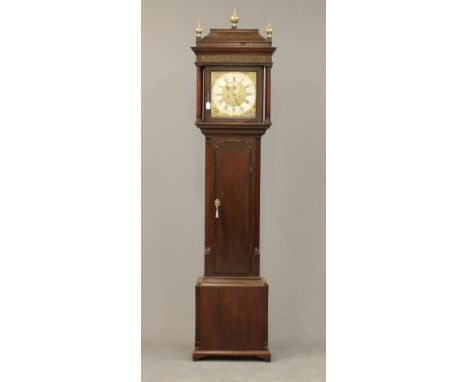 AN OAK LONGCASE by P Clare, Manchester, the eight day movement with anchor escapement striking on a bell, 12" square brass di