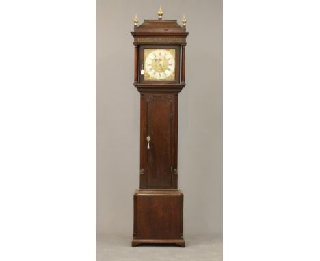 AN OAK LONGCASE by P Clare, Manchester, the eight day movement with anchor escapement striking on a bell, 12" square brass di