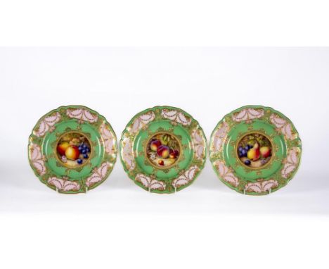 A SET OF THREE ROYAL WORCESTER CABINET PLATES, 1929 and 1931, of shaped circular form, centrally painted in polychrome enamel