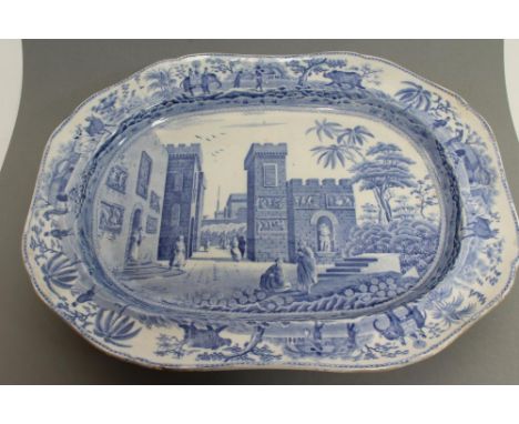 A SPODE EARTHENWARE CARAMANIAN MEAT PLATE, early 19th century, of lobed canted oblong form and printed in underglaze blue, pa