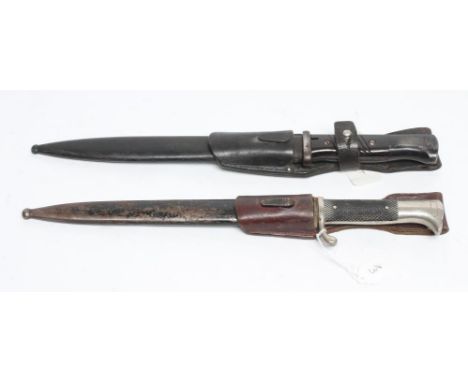 TWO THIRD REICH CARL EIKHORN BAYONETS, comprising a K98 and a dress bayonet both with leather frogs, longest 16 1/2" includin