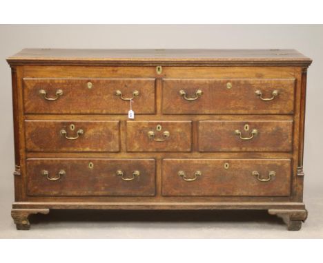 A GEORGIAN OAK AND MAHOGANY BANDED LANCASHIRE DRESSER, late 18th century, the moulded edge hinged lid opening to interior wit