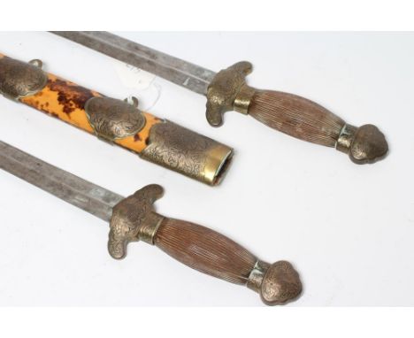 A PAIR OF CHINESE BUTTERFLY SWORDS, the two identical swords with 16 1/4" straight blades, leaf decorated cross guards, one p