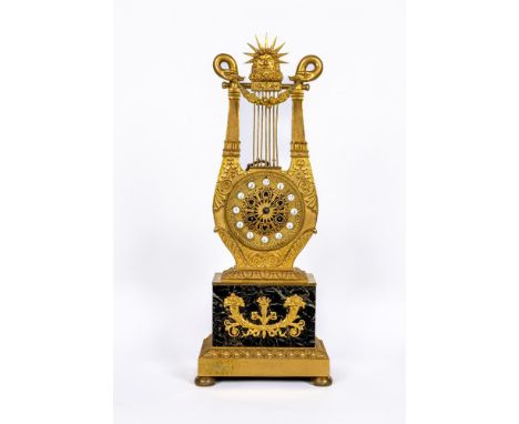 A LOUIS XVI STYLE GILT METAL LYRE MANTEL CLOCK, mid 19th century, the twin barrel movement with outside count wheel striking 