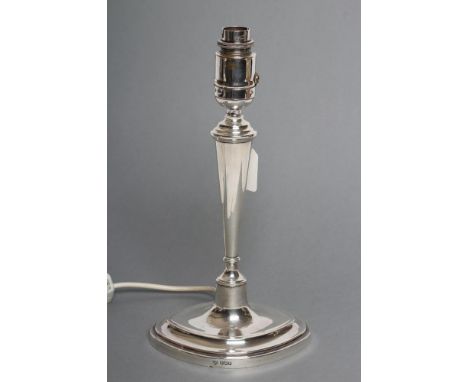 A SILVER ELECTRIC TABLE LAMP BASE, maker Elkington Ltd., Sheffield 1925, as a plain navette candlestick, 10" high excluding f