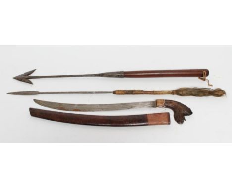 A MALAYSIAN GOLOK SWORD with 22" curved blade, dragon carved hilt and wood scabbard, 30" long, together with a harpoon with h