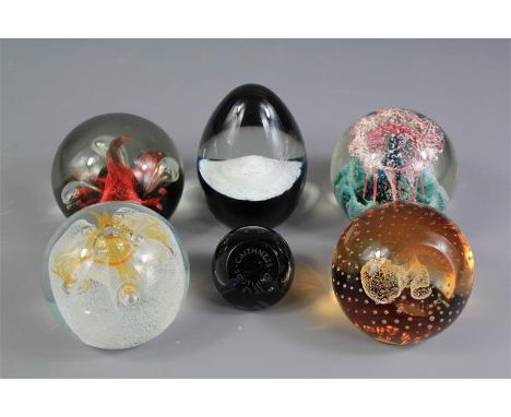 A Collection of Six Caithness Glass Paperweights. The paperweights include 'Moonflower' by Colin Terris (6)