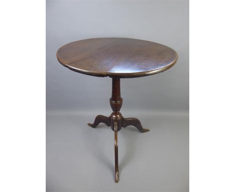 A 19th Century Oak Tilt Top Table. The table approx 56 dia x 69 cms together with an antique mahogany occasional table, suppo